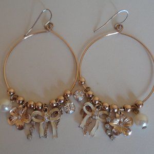 Gold toned hoops with charms